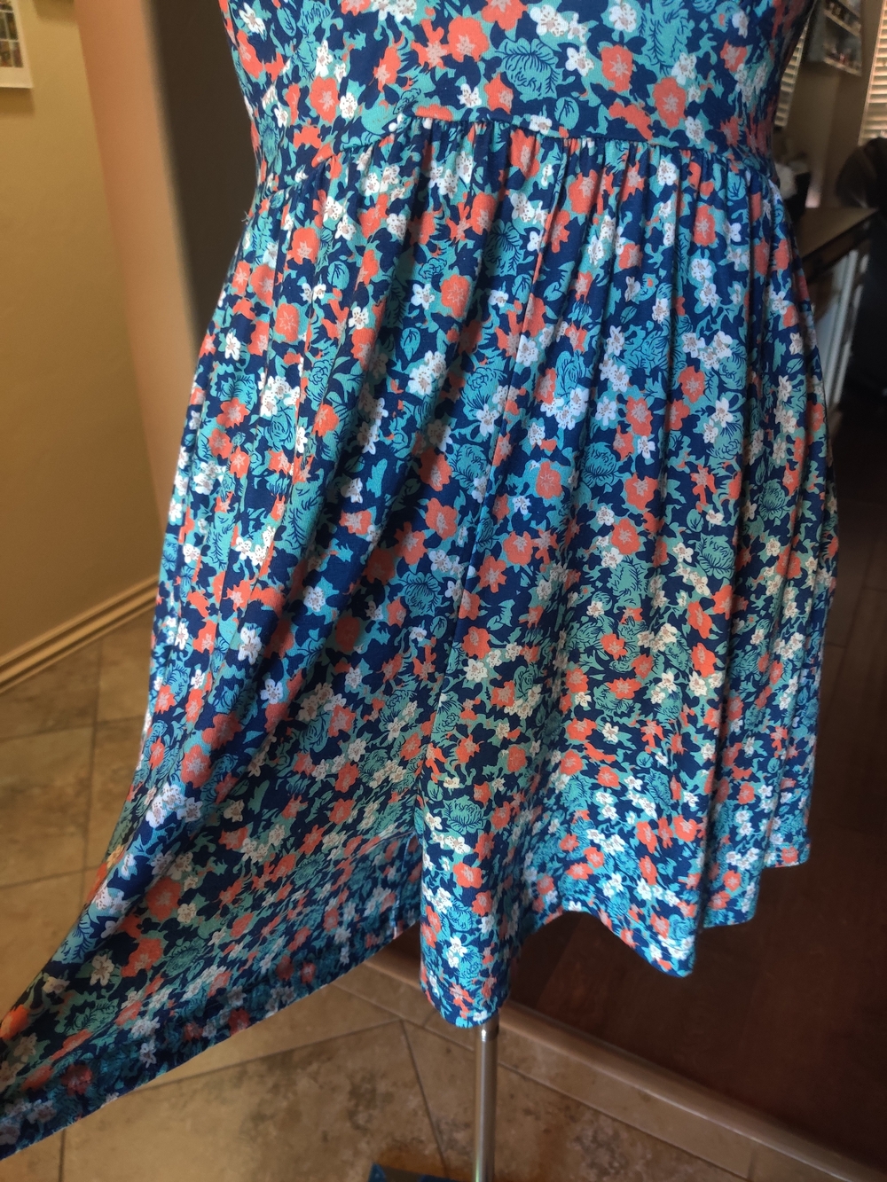 Blue and multi-color floral print halter jumper.